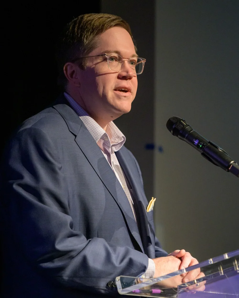 Yair Walton speaking at a podium